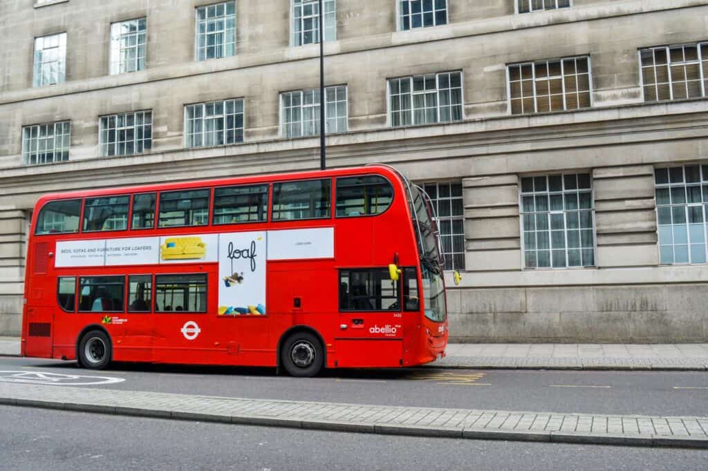 A double-decker dropping off passengers in the concept of 'how to use Romford's public transport'.